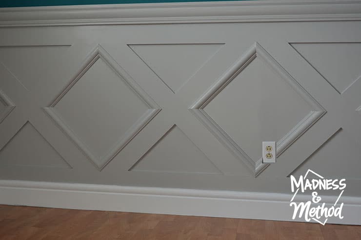 gray wainscoting with white baseboards