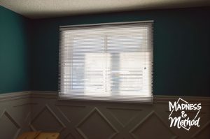 white horizontal blinds in nursery