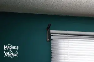 installing curtain rod in nursery