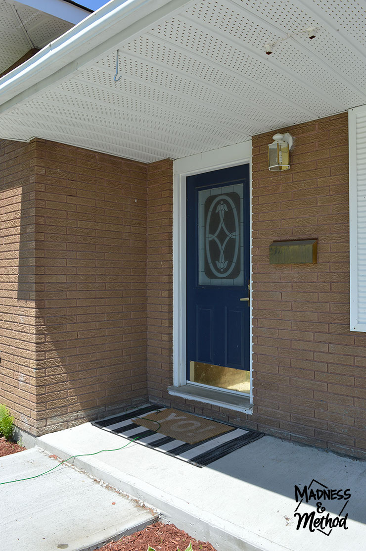 brick house with navy blue door