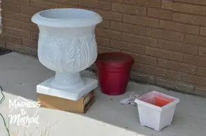 white and red painted planters