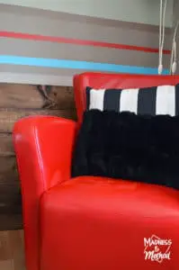 red leather chair with pillows