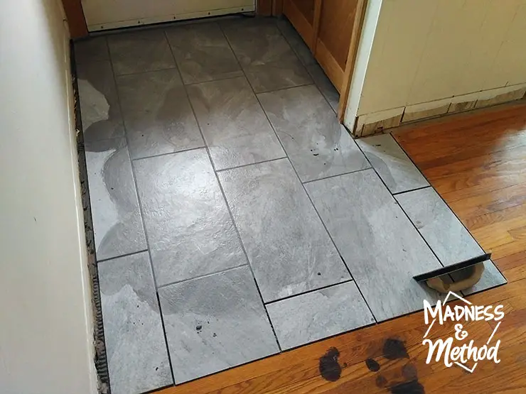 grouting the tiled floors