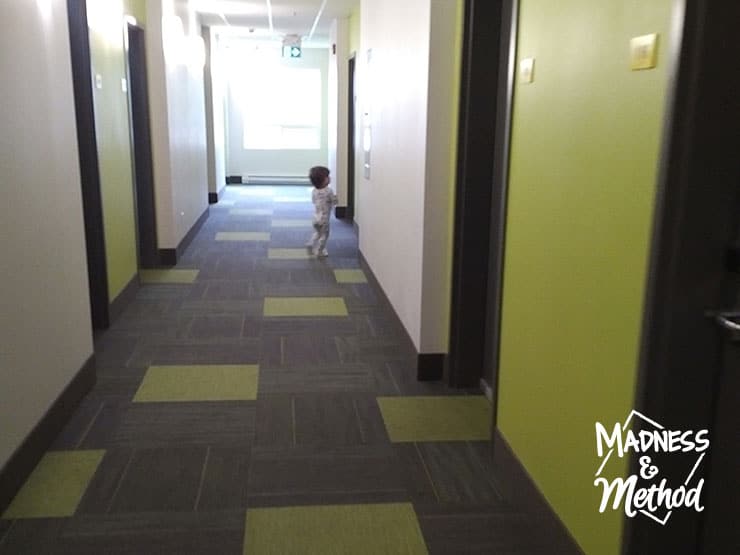 toddler in hotel hallway