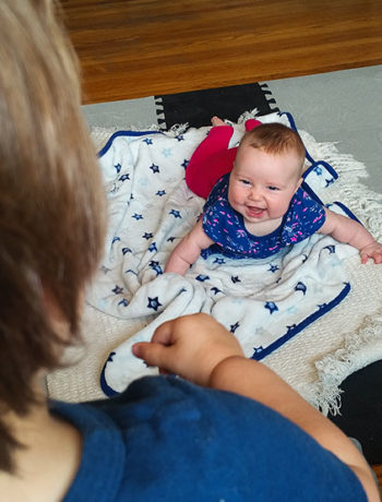 baby on mat and toddler