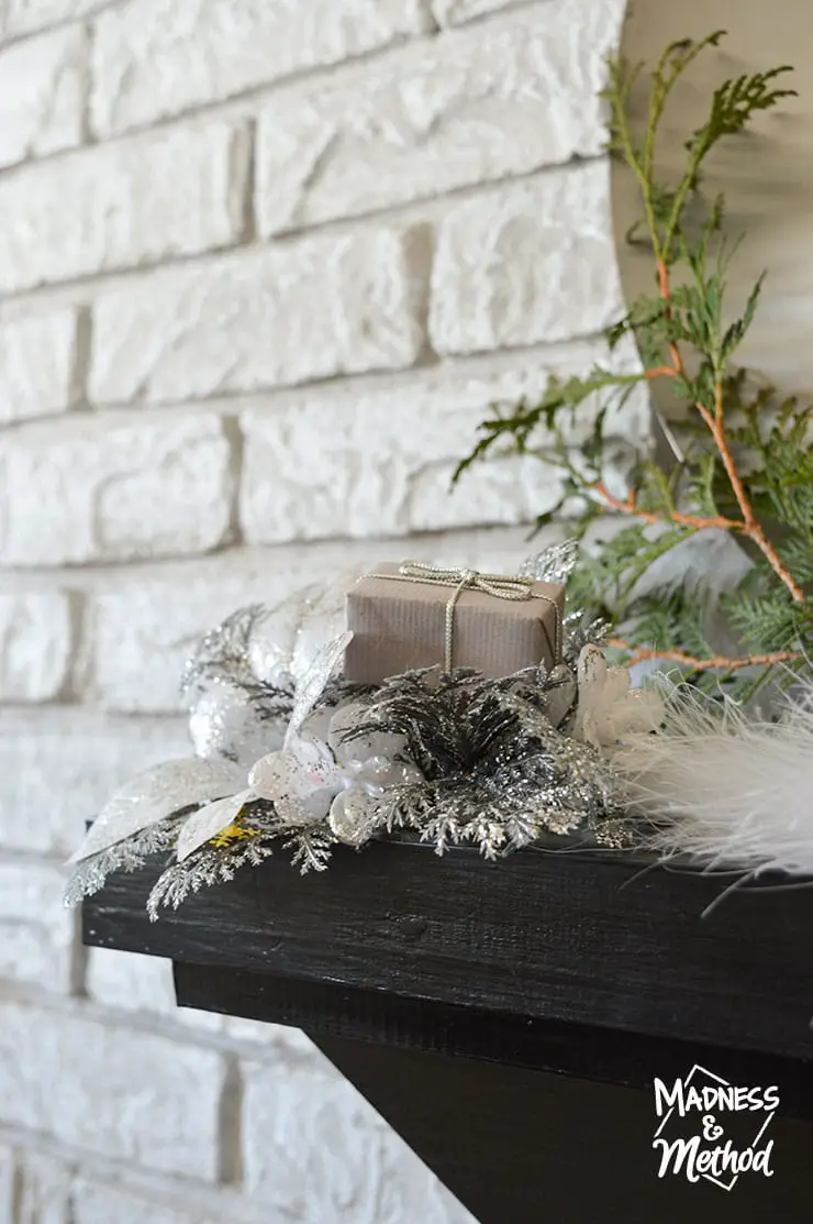 silver decor on mantel