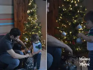 toddler helping with tree