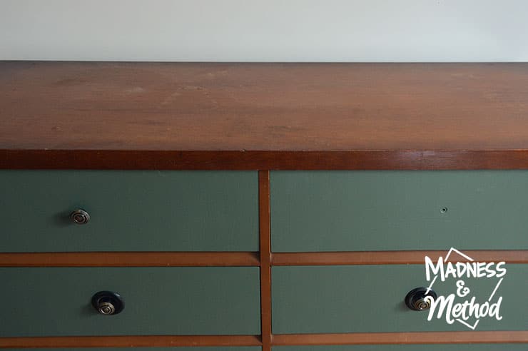 wood dresser with green drawers