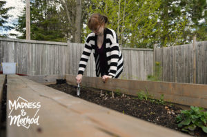 digging in raised garden bed