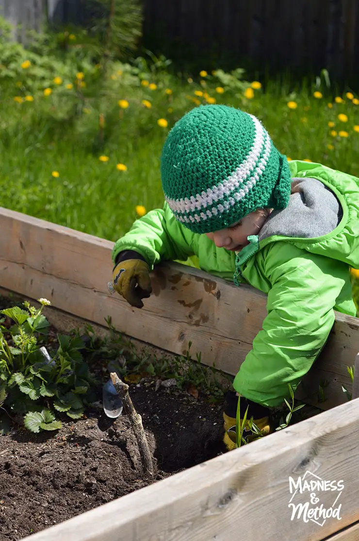 toddler digging in dirt