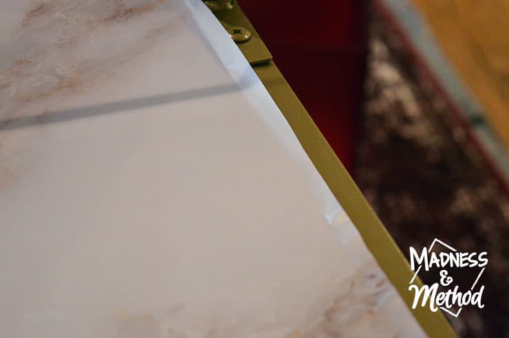 cutting marble wallpaper along edges