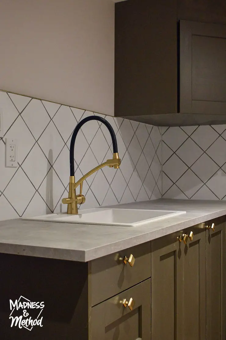 gold faucet and white sink