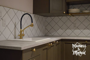 white backsplash and gray counters