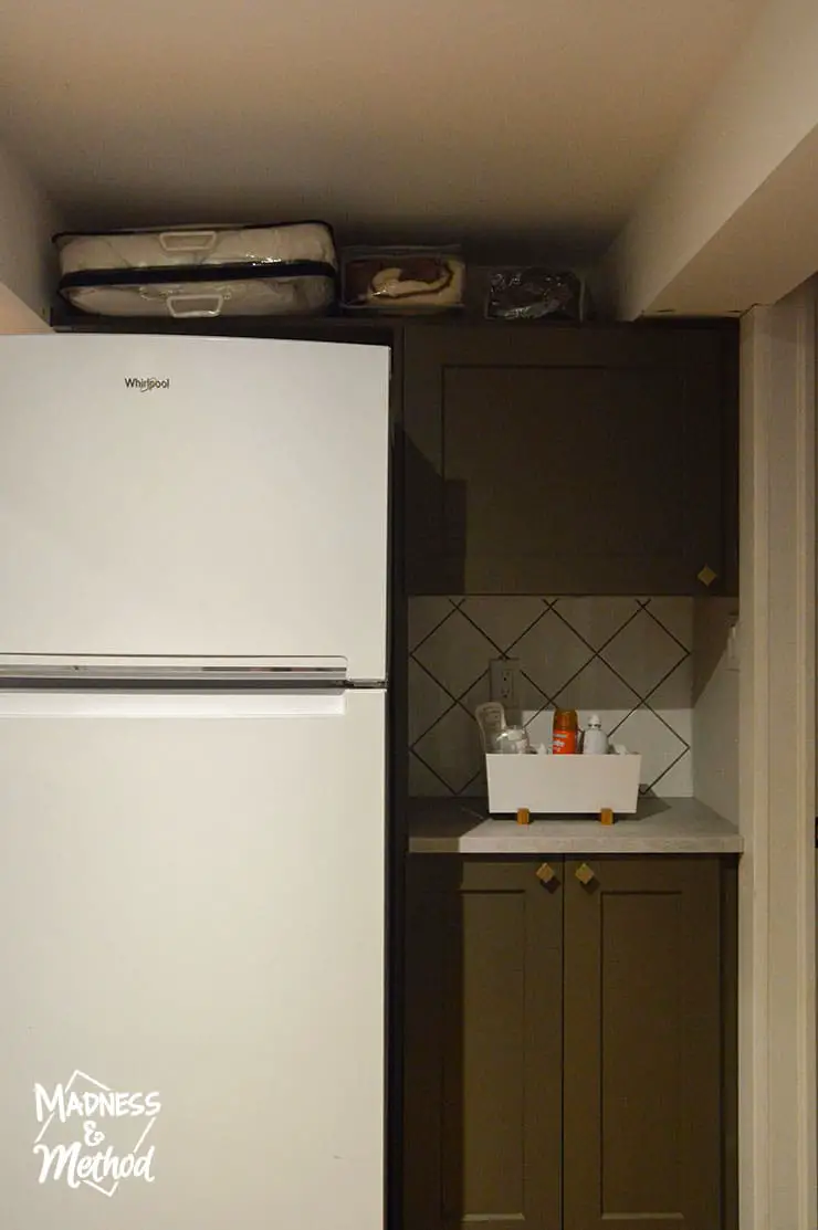 pantry area beside fridge