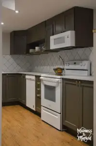 dark cabinets with white appliances