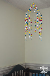 pom pom mobile above crib