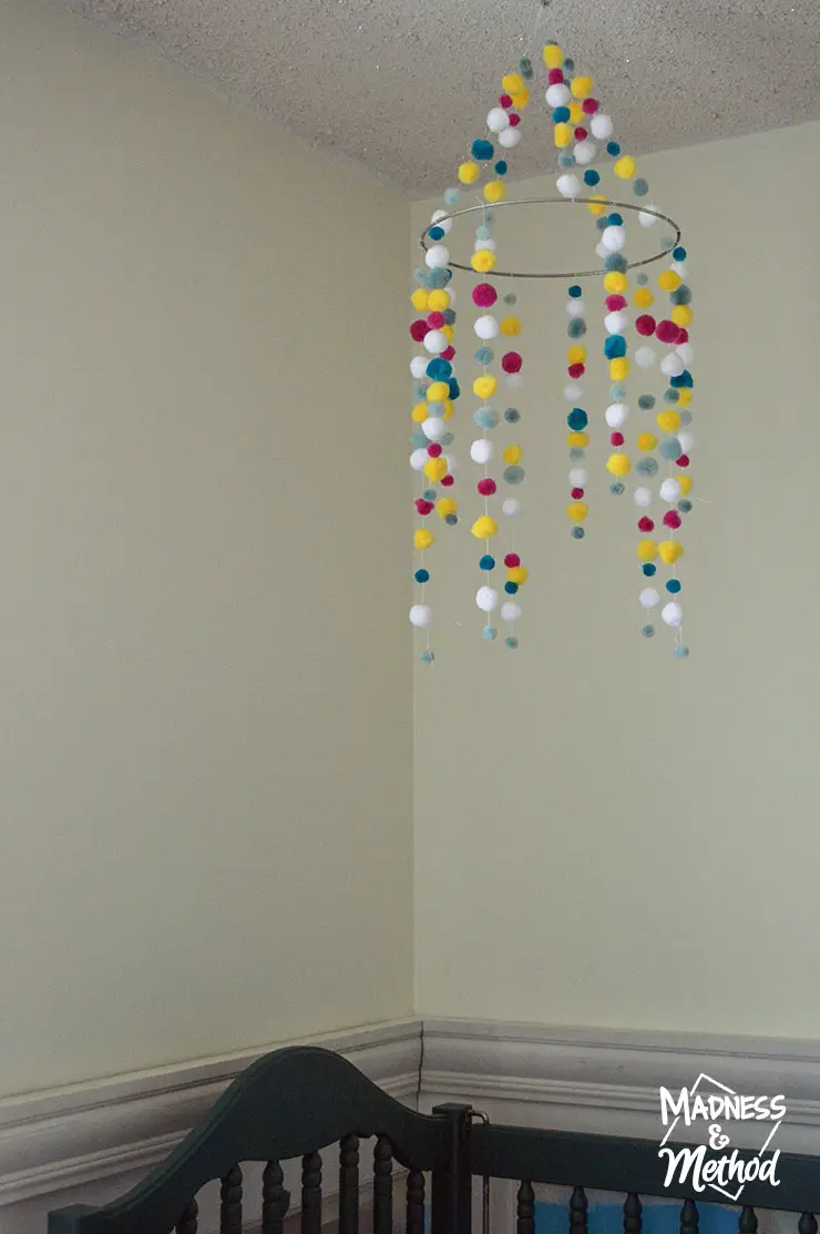 pom pom mobile above crib