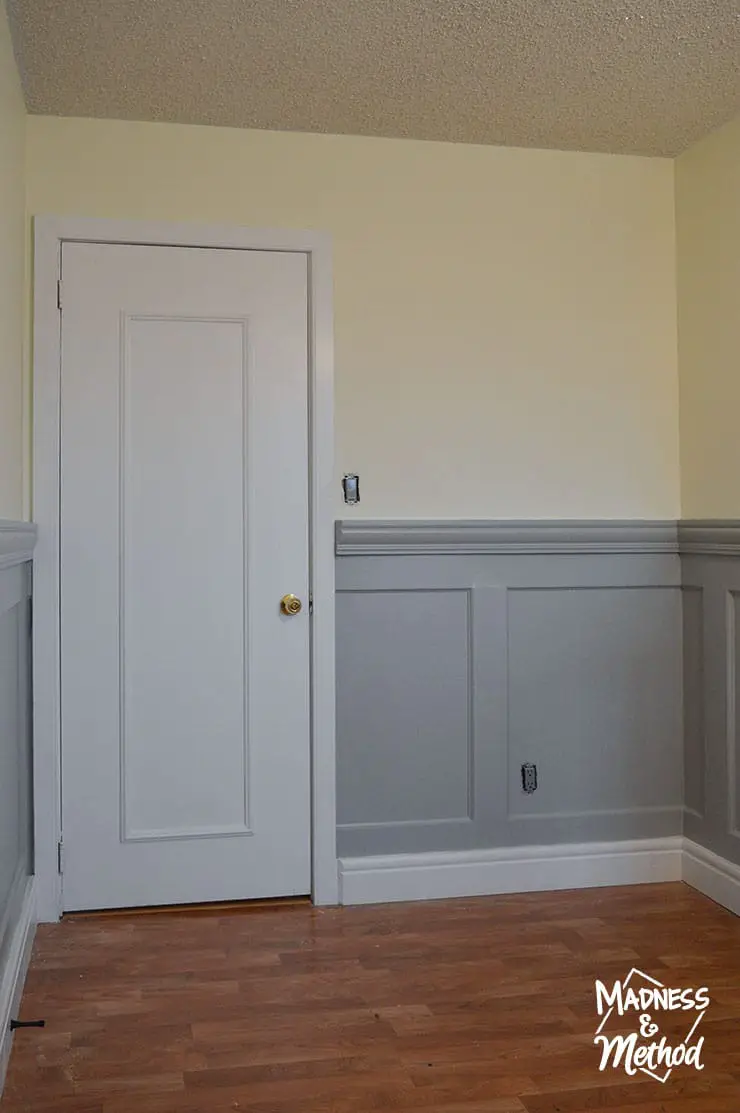 gray wainscoting with white door