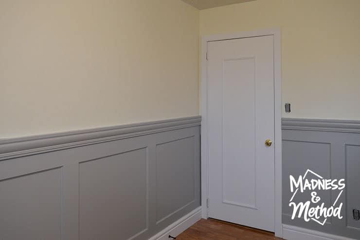 gray wainscoting and white baseboards