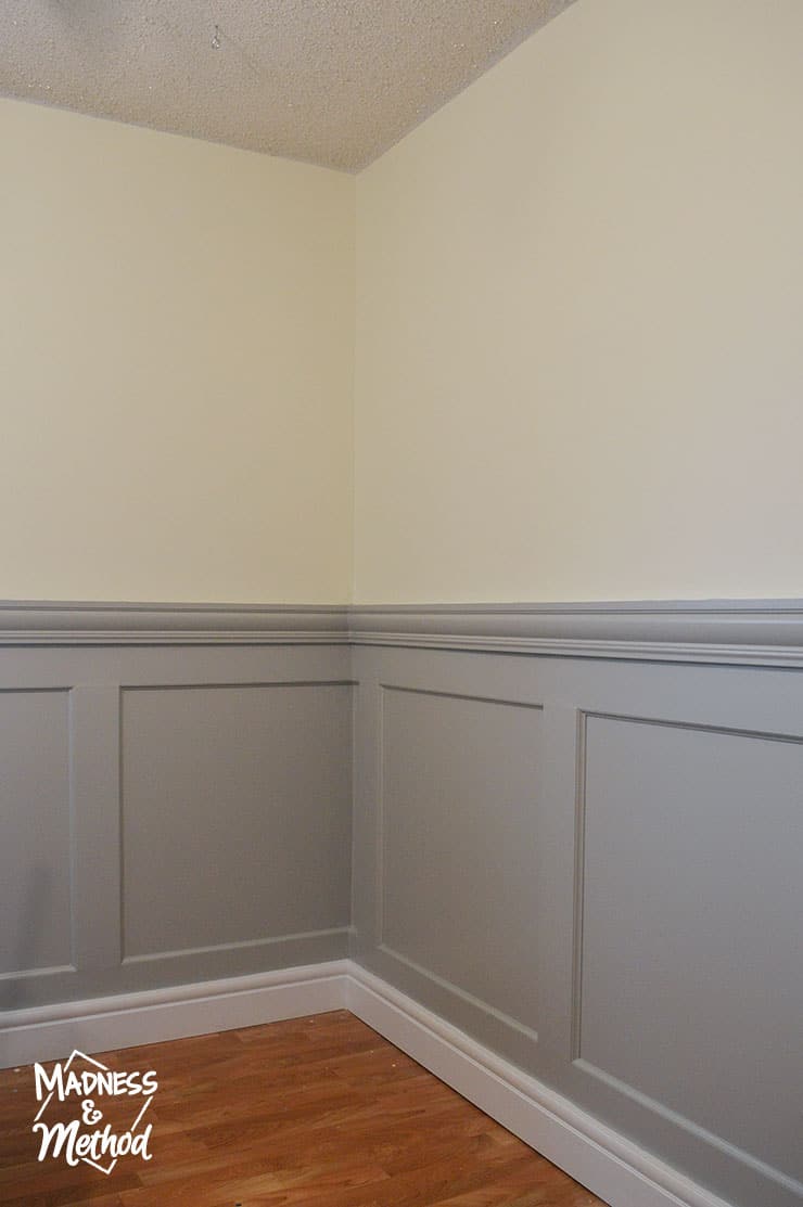 grey wainscoting with yellow walls