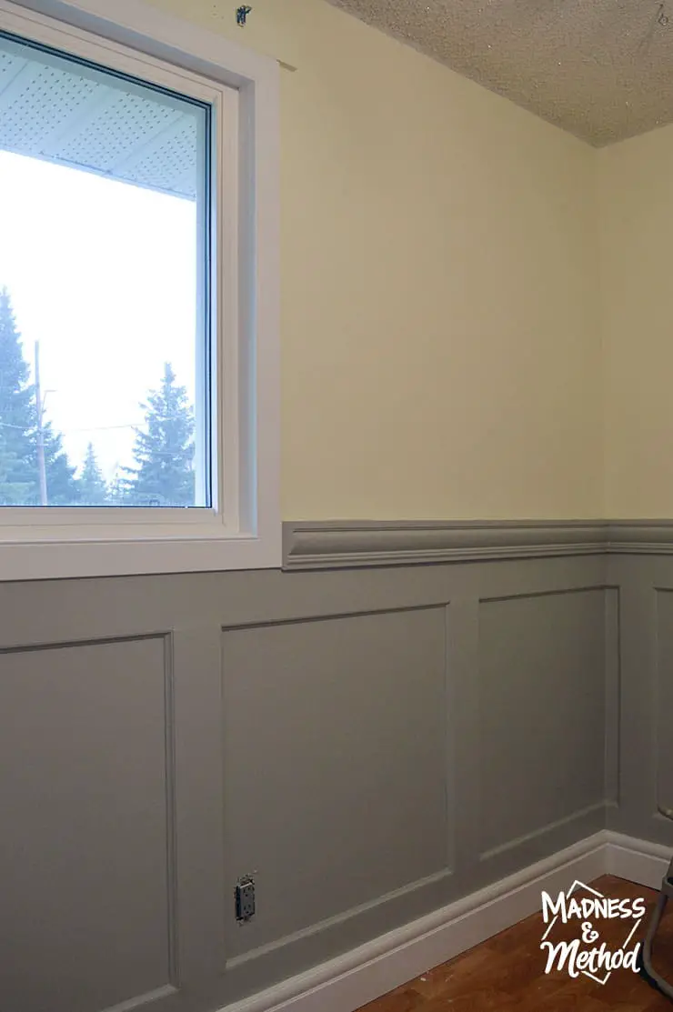 wainscoting with white windows