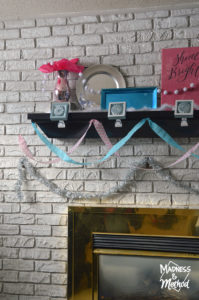 blue and pink baby mantel decor