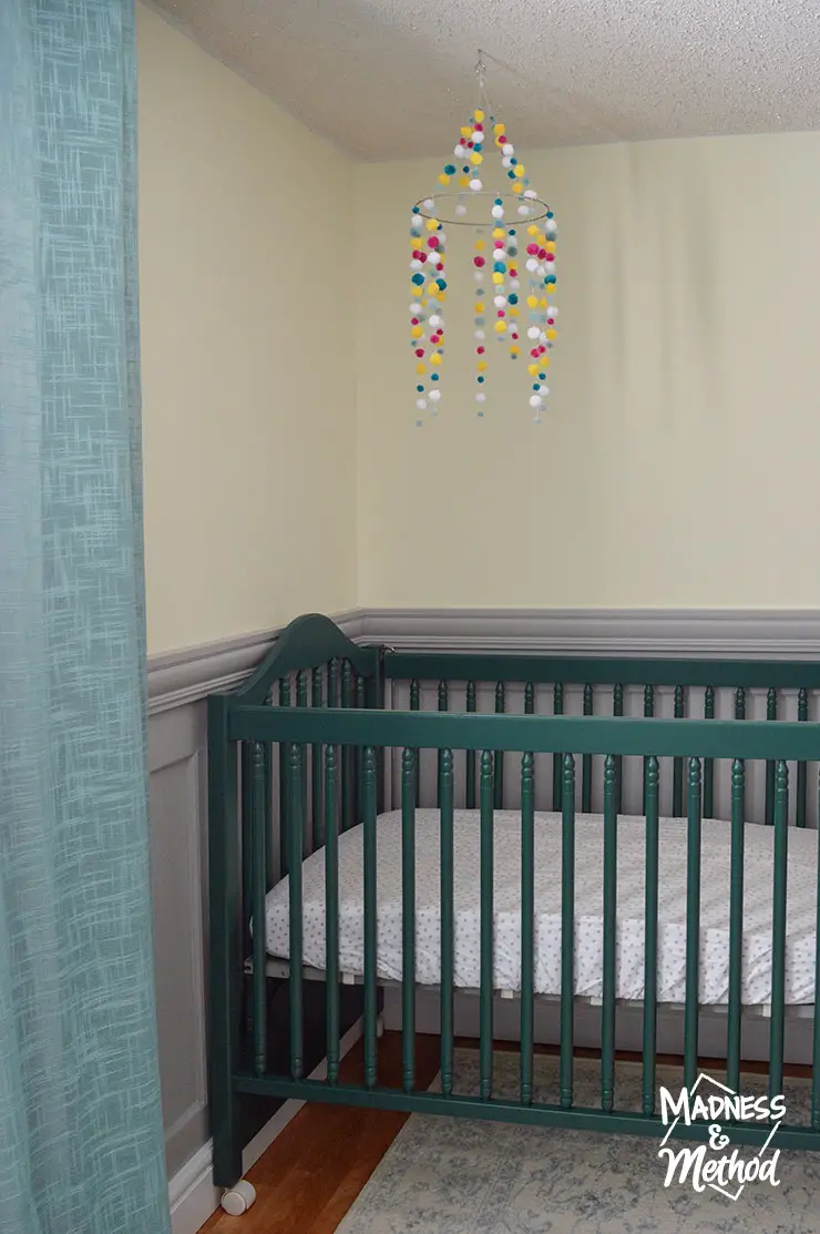 dark teal crib and aqua curtains