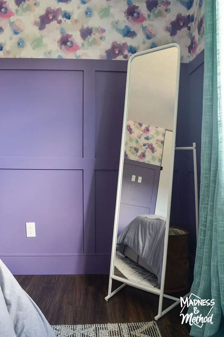 white mirror purple walls