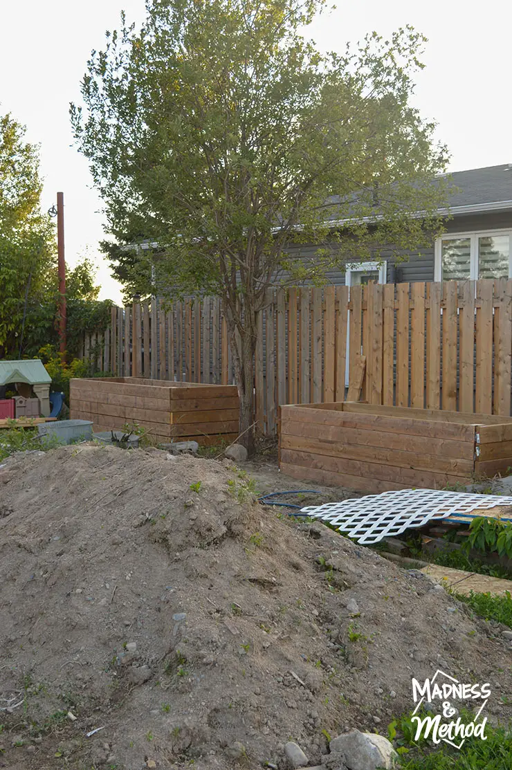 raised gardens next to fence