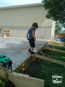 zachary playing on garage concrete