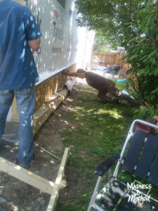 pushing garage wall into place