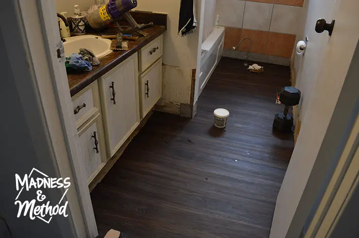 dark vinyl planks in bathroom