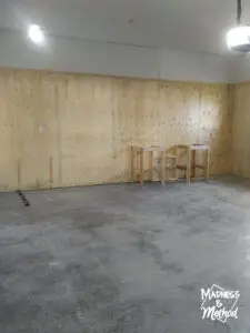 empty garage with plywood walls