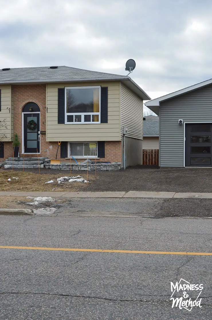 raised ranch house with detached garage