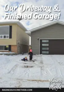 snow covered driveway and finished garage
