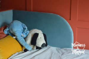 blue headboard red walls