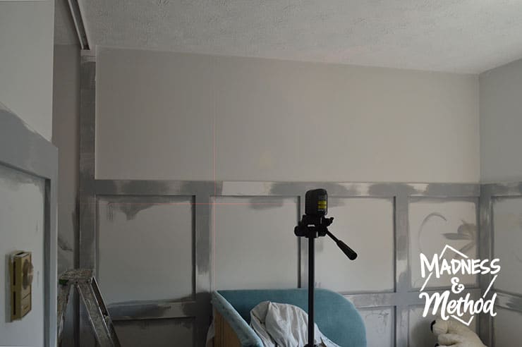 using laser level to install wallpaper panel