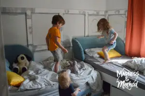 kids jumping in bedroom