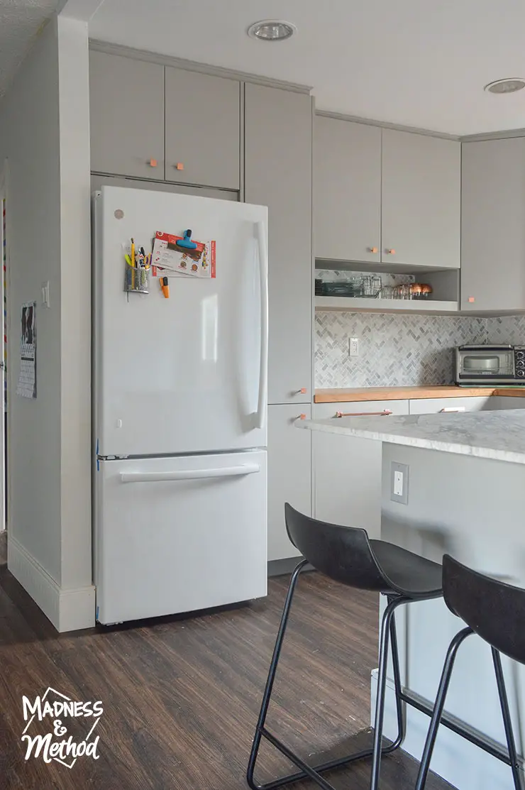 fridge on end of kitchen