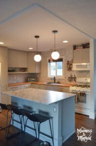 globe pendants above island