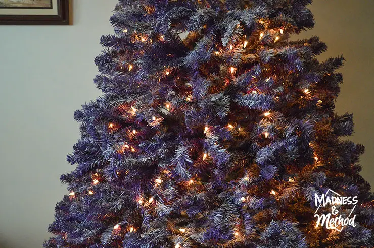 flocked purple tree with lights