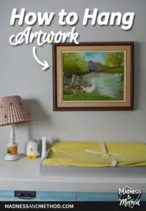 how to hang artwork text overlay on white wall with painting and change pad
