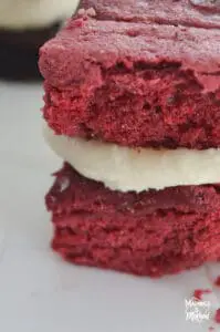 closeup of red velvet brownies with cream cheese frosting