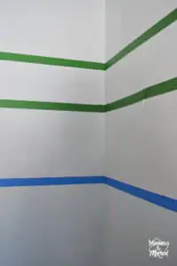 painters tape across a corner with laser level