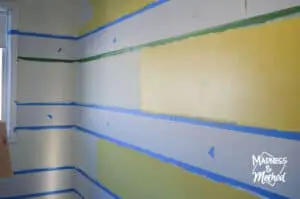 adding darker yellow paint to striped walls