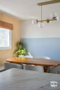 blue dining room with wood slat wall