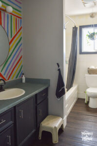 rainbow bathroom with dark vanity