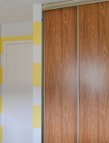 faux wood sliding closet doors in bedroom