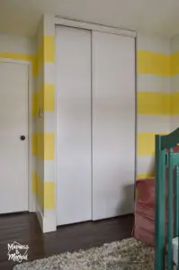 white painted sliding closet door in bedroom