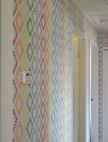 subtle rainbow hallway with white doors